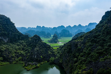 Naklejka na ściany i meble Aerial drone photo - Mountains and rice fields of northern vietnam