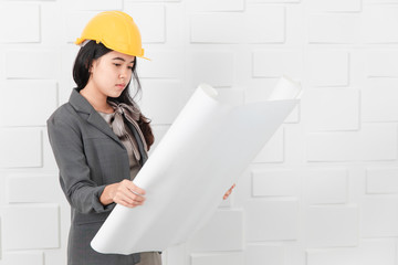 Asian architect at construction site office