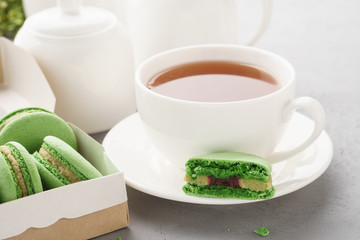 Pistachio macarons with berry filling and tea for dessert.