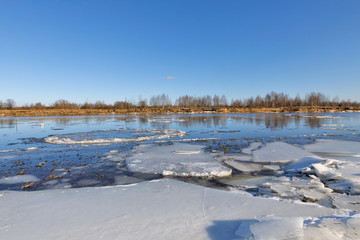 Fototapeta na wymiar Cracked ice on river. Spring season
