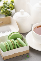 Pistachio macarons with berry filling and tea for dessert.