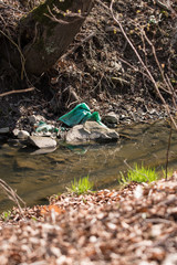Green plastic foil blown up by the river.