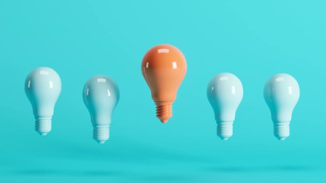 Outstanding orange lightbulb among light blue lightbulbs floating on blue background. 3D Animation.