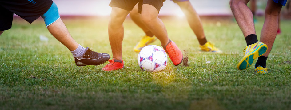 People Playing Soccer In Public Park For Exercise. Football Around The World Concept.