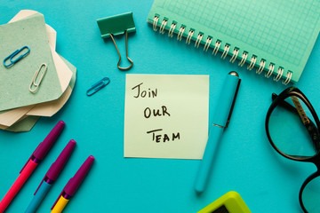 "JOIN OUR TEAM" CONCEPT. Office workplace top view, copy space.Flat lay office table desk.Labor market concept. Job vacancy,new recruitment, trainee, occupation.Job recruiting advertisement represent.