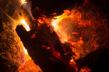 Bright sparkling coals with fire as background