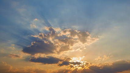 sun rays are striking through the clouds