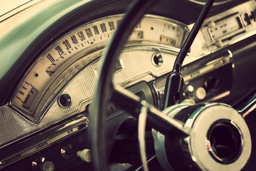 Classic car interior with close-up on steering wheel
