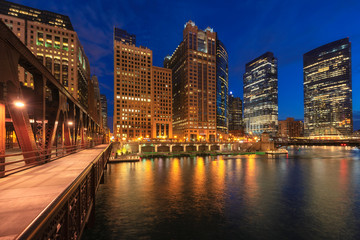 Night view of Chicago city and bridges cross river in Chicago, Illinois