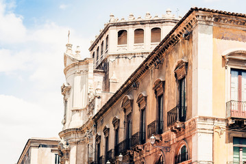 Beautiful cityscape of Italy, historical street of Catania, Sicily, facade of old buildings.