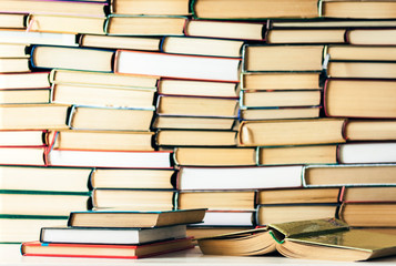 Fototapeta premium Books background, open book on white wooden table in office for education learning concept.