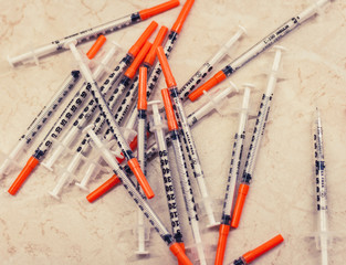 Pile of medical syringes for insulin for diabetes .