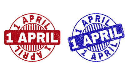 Grunge 1 APRIL round stamp seals isolated on a white background. Round seals with distress texture in red and blue colors. Vector rubber imprint of 1 APRIL label inside circle form with stripes.