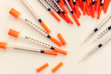 Pile of medical syringes for insulin for diabetes .