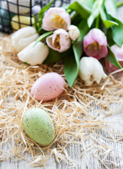 Easter eggs and tulips bouquet