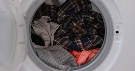 Load clothes to washer machine