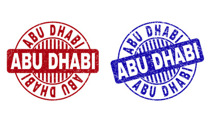 Grunge ABU DHABI round stamp seals isolated on a white background. Round seals with grunge texture in red and blue colors. Vector rubber imitation of ABU DHABI tag inside circle form with stripes.