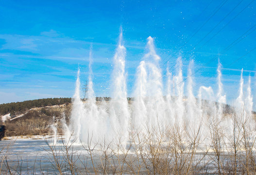 Ice Blasting (cleaning). Landscape With  Beautiful Frozen River With Reflection In Water Wet-ice Blasting. Early Spring Landscape. Spring  Nature River Landscape. Selective Focus.