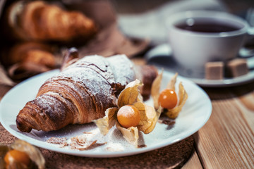 Delicious continental breakfast with fresh flaky croissantsl and coffee