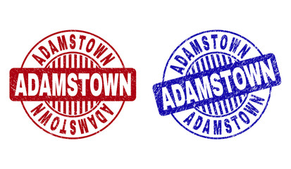 Grunge ADAMSTOWN round stamp seals isolated on a white background. Round seals with grunge texture in red and blue colors. Vector rubber imprint of ADAMSTOWN text inside circle form with stripes.