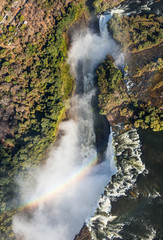 Fototapeta na wymiar The Victoria falls is the largest curtain of water in the world. The falls and the surrounding area is the Mosi-oa-Tunya National Parks and World Heritage Site (helicopter view) - Zambia, Zimbabwe. Af