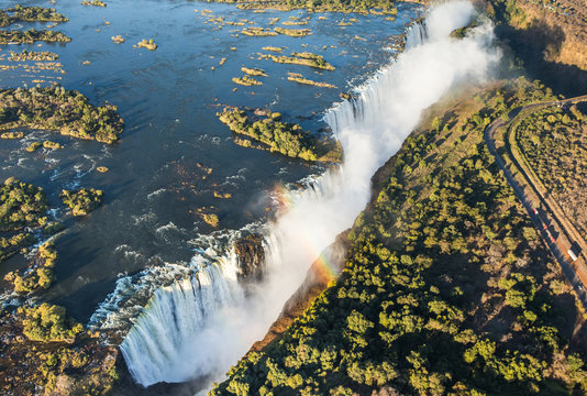The Victoria falls is the largest curtain of water in the world. The falls and the surrounding area is the Mosi-oa-Tunya National Parks and World Heritage Site (helicopter view) - Zambia, Zimbabwe. Af