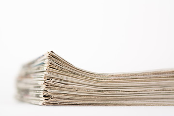 Some fresh weekly newspapers on a white background
