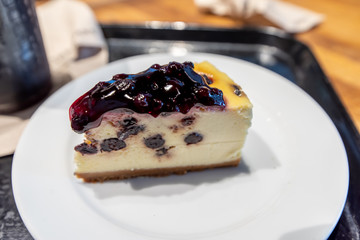 Blueberry cheese cake on the white plate