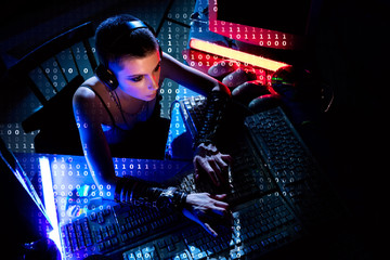 Female hacker working on a code with digital interface around