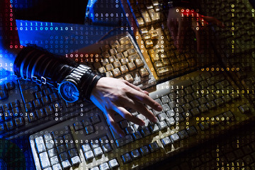 Hacker's hand on the keyboard