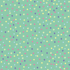 Pattern with multi-colored points on a green background
