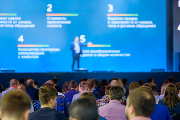 Audience listens to the lecturer at the conference