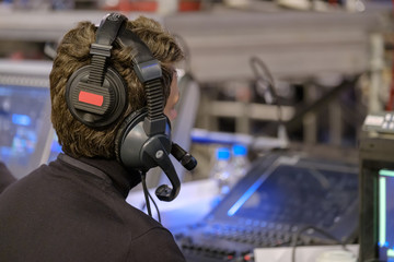 Video broadcast operator workis at business conference