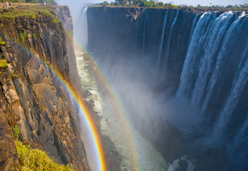 Victoria Falls. A general view with a rainbow. National park. Mosi-oa-Tunya National park. and World Heritage Site. Africa. Zambiya. Zimbabwe. 