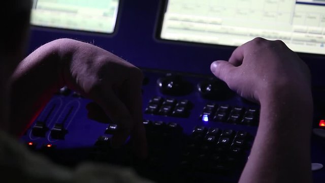 remote recordists closeup. Hand adjusts sound effects. Electric machine on table for working of sound designer or club dj at party in nightclub. Occupation for modern lifestyle, objects for listen at 
