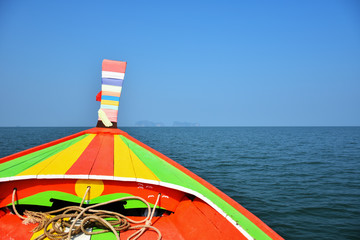 colorful long tail boat ferry to the island for activities in the sea with copy space