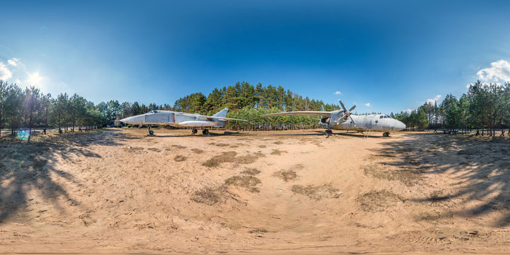 full spherical hdri panorama 360 degrees angle view in forest guerrilla camp with old military transport aircraft and fighter airplane in pinery forest in equirectangular projection. VR AR content