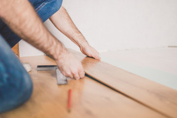 Finishing work at home - laying a new laminate flooring