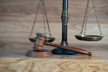 Law and justice concept image. Brown wooden background