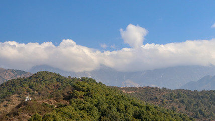 Clouds over Mountains, Landscape in the mountains, View from the Indrunag, Dharmashala, Himachal Pradesh, India.