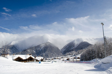 Scenic view of mountains slopes and apartments at ski resort Laura Russia