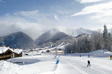 Scenic view of mountains slopes and apartments at ski resort Laura Russia