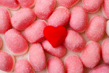 Pink jellies or marshmallows as background