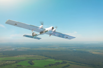 Fototapeta na wymiar Unmanned military turboprop drone on patrol air territory at low altitude.