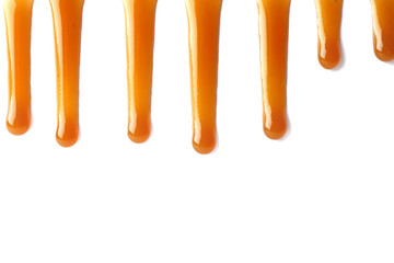 Stains of liquid caramel on white background