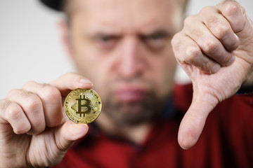 Man having bitcoin coin