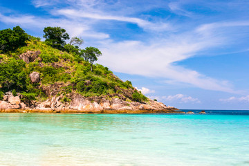 Fototapeta premium Beautiful tropical beach with pur white and blue sky and nobody or crowded tourist to fight for an inch of sun light