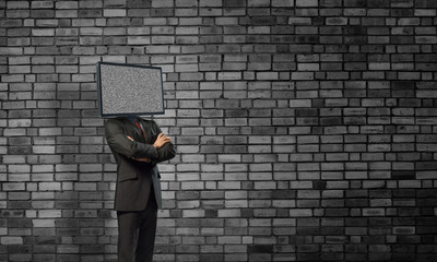 Businessman with TV instead of head.