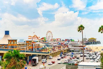  Famous Pier in Santa Monica with tourists, a suburb of Los Angeles. © BRIAN_KINNEY