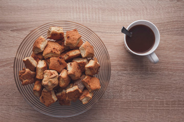 Cup of hot cocoa and cookies on a wooden background